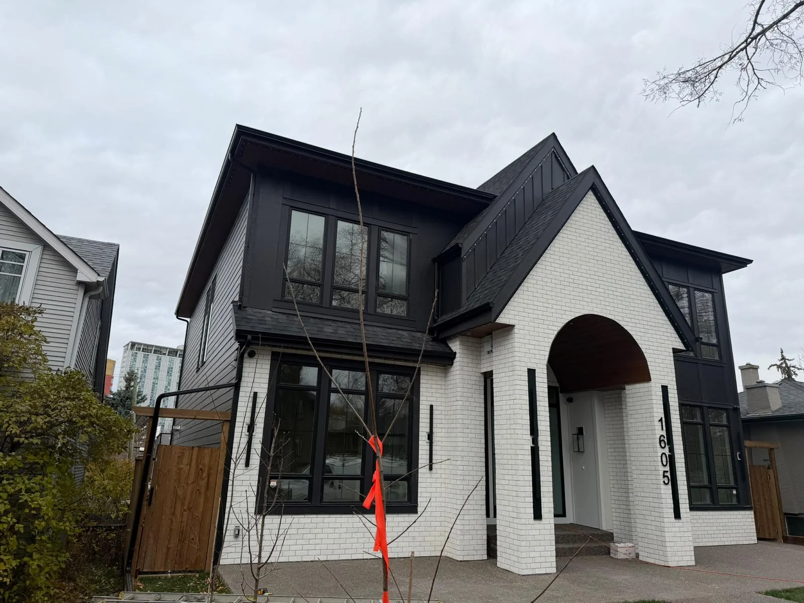 Angled view of a white and charcoal home exterior